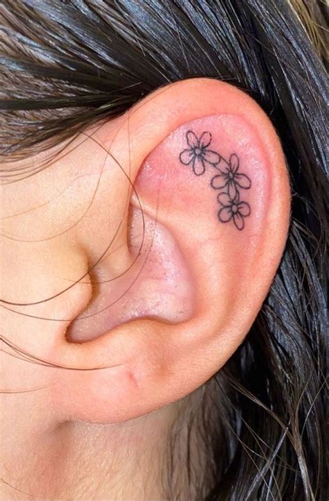 earlobe tattoos for females|feminine ear tattoos.